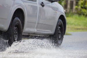 car accident because of water pooling on the road